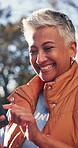 Laugh, text and volunteer in park with phone, digital chat and comic post during campaign program. Happy, bokeh and mature woman with tech, online notification and funny message on outreach break.