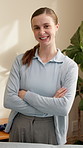Woman, crossed arms and face of physiotherapist in clinic with confidence for medical support career. Happy, about us and portrait of healthcare worker with pride for physical therapy in office.