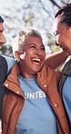 Volunteer, laugh and team in park with bonding, joke reaction and collaboration in charity campaign. Social, bokeh and people with humor, happy moment and friendship connection in welfare project.
