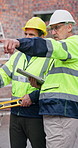People, pointing and tablet at site for construction, research and inspection report for architecture. Team, talking or review at worksite with digital, maintenance checklist and building development