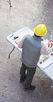 Architect, man or partnership with handshake on construction site for building plan or design. Top view, male people or civil engineer shaking hands for b2b meeting, architecture project or deal