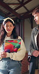 Education, friends and happy people with books, walking and conversation at university or knowledge. College, discussion and students with academic goals, learning and smile with textbook on campus