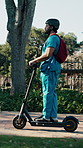 Man, medical student and scooter at campus for travel, outdoor and ride to class with backpack and helmet. Person, electric vehicle and transport to university for education, development or learning
