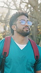 Medical student, phone and walk with man on campus for learning schedule, doctor residency and college. Healthcare internship, contact and medicine program with person in university for text message