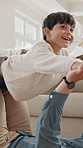 Dad, child and flying in home for fun bonding, holiday or break together on living room floor. Father, son or kid with smile or airplane for playful imagination, balance or happy childhood in house