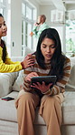 Remote work, child and disturb mother with tablet to play, distraction and bother in family home. Tech, girl and attention with freelance parent on sofa in living room, busy and annoyed with daughter