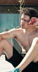 Fitness, outdoor and tired man on break, rest and exhausted after intense workout and wipe sweat. Male person, athlete and pause with fatigue for wellness, health or tough training exercise in summer