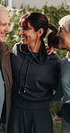 Happy, friends and hug in backyard for fitness, discussion and feedback on training session. Trainer, senior people and laugh at house with embrace, funny conversation and pilates advice for wellness