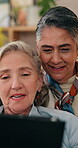Tablet, mature and lesbian couple in home with discussion, planning holiday and booking flight ticket. Happy, lgbt women and talk in living room with tech, relationship and research for vacation.
