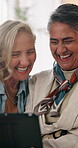 Tablet, mature and lgbt couple in house with laugh, bonding together or discussion for funny movie. Happy, lesbian women and talk in lounge with tech, relationship and humor for romantic comedy show.