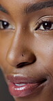 Thinking, woman and makeup in studio for beauty, foundation glow and change for clear skin. Closeup, African person and cosmetics for facial transformation, makeover and aesthetic on gray background