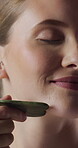 Facial massage, skincare and woman with gua sha, glow and smile with anti aging benefits and beauty. Dermatology, wellness and happy person with cosmetic tool for healthy skin, self care and shine