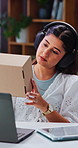 Box, entrepreneur and woman with tablet, headphones and inventory for sales on online shop in home. Small business, music and person with tech for logistics, distribution and info for digital store