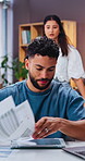 Annoyed, man and reading in home with documents, finance report and pressure of overdue bills. Frustrated, couple and tablet at house with paperwork, financial burden and debt problems for bankruptcy