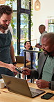 Waiter, man and machine at cafe with card, payment and contactless for transaction. Server, male person and electronic pos for checkout, purchase coffee and fintech for customer experience at store