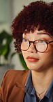 Creative, glasses and business woman in office for thinking, reading and ideas for online story. Night, computer and person with reflection, inspiration and solution for article at publishing agency