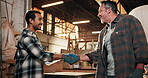 Men, handshake and woodworking team with clipboard for deal, gloves or happy for project development. Partnership, people and shaking hands in timber factory for cooperation, productivity or contract