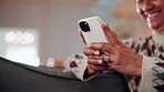 Laugh, phone and hands on sofa with texting, online communication and comic post on social media. Happy, space and mature woman in house with tech, funny message or meme reaction on digital app.