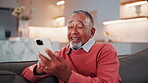 Laugh, phone and old man on couch with texting, online communication and comic post on social media. Happy, scroll and senior person in house with tech, funny message or meme reaction on digital app.