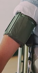 Nurse, hands and blood pressure machine with patient for heart rate, BPM or medical exam in home. Healthcare worker, caregiver or monitoring with arm strap for hypertension, checkup or test in house