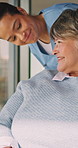 Senior, nurse and happy woman with wheelchair for mobility, assisted living or healthcare in home. Caregiver, health worker or female person with a disability for medical assistance or help in house