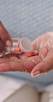 Health, hands and elderly woman with pills for wellness, prescription or daily dosage for self care. Medication, bottle and senior person with drugs for healing, supplement and medicine in retirement