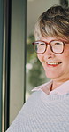 Senior, thinking and window with happy woman in retirement home for vision, past moment or memory. Thoughtful, elderly or female person contemplating with sight, reflection or nostalgia in house