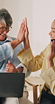 Credit card, laptop and high five with women in home for online shopping, banking app help and ecommerce. Digital transaction, caregiver and celebration with fintech and mature person in living room