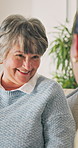Laugh, chat or senior woman in house with smile, funny conversation or happy moment in lounge. Hangout, gossip or elderly person with communication, joke reaction or humor connection in retirement.