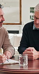 Senior, man and insurance agent in home with clipboard, conversation and feedback for risk assessment. Old person, talk and broker in consultation with checklist, retirement planning or policy cover.
