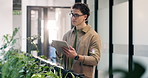 Man, thinking and tablet in office with sustainability audit, review carbon footprint and research. Person, scroll and tech in business with glasses, environmental impact report and problem solving.