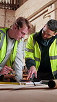 Carpentry, team and blueprint in workshop meeting for shopfitting, design review or quality control. Carpenter, men and talking with building plan for woodwork project, operation report or evaluation