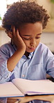 Thinking, education and child with homework in house for learning, development or growth. Notebook, knowledge and boy student with studying for mathematics quiz, assessment or test in apartment.