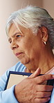 Thinking, senior or woman with picture frame for memory, past love or remembrance in home. Elderly, female person or widow with hug, grief or photo canvas for sentimental story, mourning or reminisce