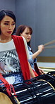 Taiko, creative and women with drums for lesson, rehearsal or learning cultural choreography. Bachi percussion, practice and people in Japanese band for sound coordination, performance or rhythm.