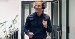 Dancing, happy and businessman in office with headphones for music, playlist or radio for good news. Smile, audio tech and mature corporate employee listening to album with rhythm for job promotion.