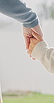 Mom, walking and holding hands with child for outdoor safety, protection or security in neighborhood. Mother, trust or support with kid, comfort or care for weekend, holiday or bonding together