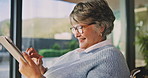 Smile, mature woman and laugh with tablet in home for social media, website and texting contact. Happy person with a disability, tech and communication with notification or message update in house