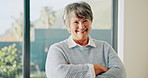 Senior, face or happy woman with confidence in retirement home for free time or pension. Portrait, female person or pensioner with smile or arms crossed for elderly break, holiday or weekend in house