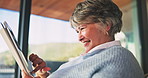 Tablet, happy and senior woman in home reading blog on retirement planning for finance advice. Digital technology, update and elderly person on website for article on tips of pension savings.