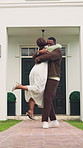 Excited, black couple and hug outdoor with new home, property investment and happy for dream house. Marriage, spin and man with woman for real estate purchase, mortgage approval and residence goals