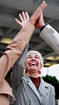 Business people, high five and celebration with tablet in city for teamwork, achievement or winning. Group, happy employees and support with smile for promotion, partnership for broker outdoor