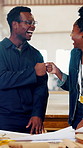 Black people, carpenter and fist bump in workshop for manufacturing, products design or woodwork. Engineer, smile and excited with celebration for building, deal or factory startup for small business