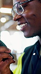 Architect, talking or black man with radio for shipping control or distribution safety in warehouse. Male person, contractor or civil engineer speaking with signal for security on construction site