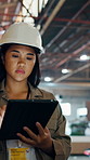 Tablet, thinking and logistics worker in warehouse for research on cargo, distribution or delivery. Walking, woman and Asian supply chain manager with digital technology for order confirmation.