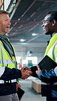 Businessmen, architect and meeting with handshake in warehouse for construction agreement or deal. Male people, contractor or civil engineer shaking hands with smile in depot for building partnership