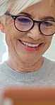 Senior, home and happy woman with tablet for entertainment, online game or bingo in retirement. Elderly, female person or smile with technology or glasses for network connection or fun app in house