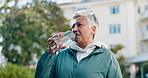 Fitness, drinking water and mature woman outdoor for rest, workout recovery and wellness. Exercise break, hydration or thirsty female person with bottle in city for health, electrolytes or nutrition