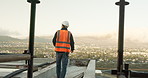 Thinking, man and engineer at site for construction, inspection and safety check for architecture. Back, male person or walk on rooftop, quality assurance and progress of building development in city