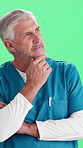 Thinking, doctor and man in studio for healthcare decision, medical service or choice for medicine. Mature, idea and person with solution, problem solving or planning for wellness on green background